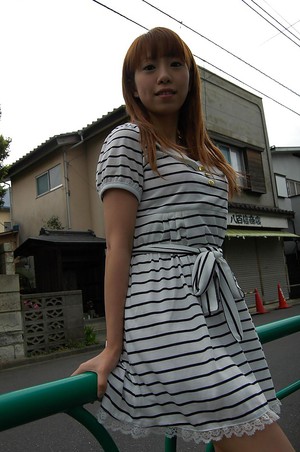 Asian Chihiro Ozawa is walking in her sexy striped dress outdoors